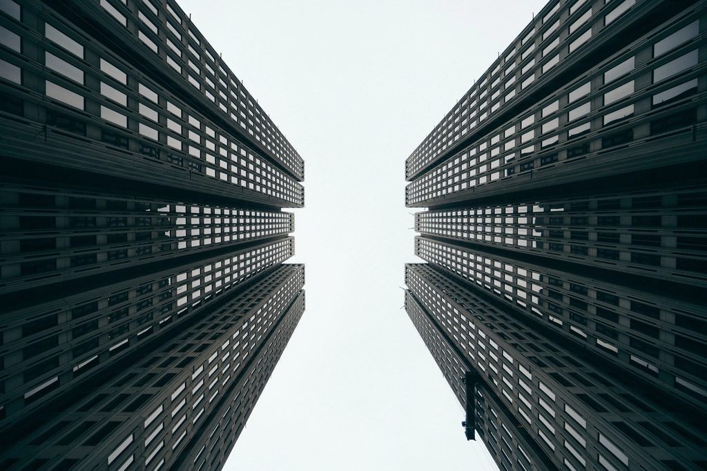 Twin commercial towers from street level.