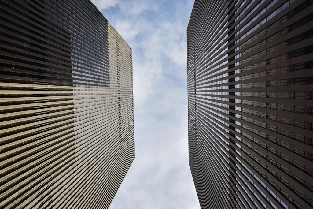 Corporate office towers rising against the sky.